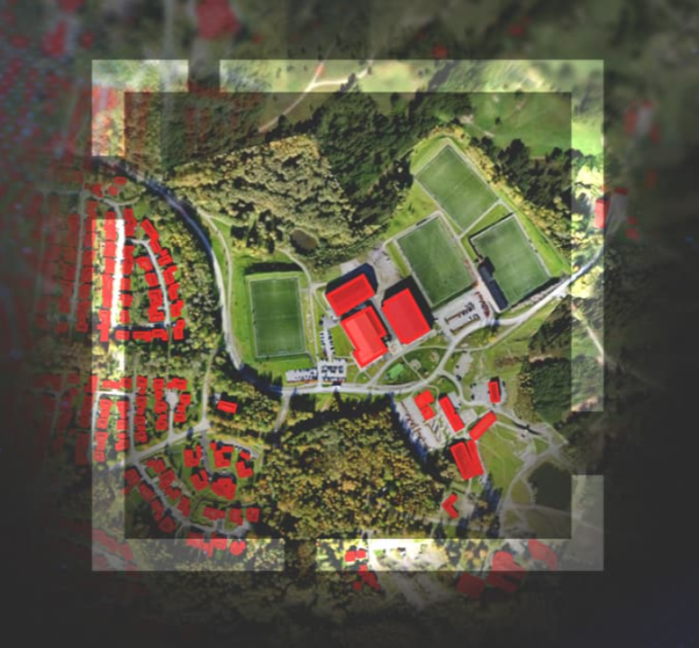 Aerial image with buildings highlighted in red.