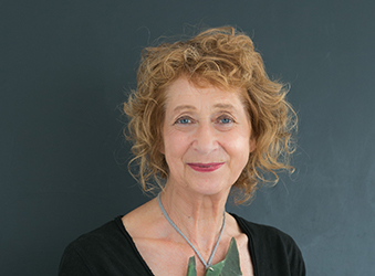 Woman smiling for photo.