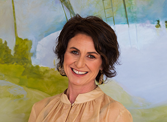Woman smiling for photo.