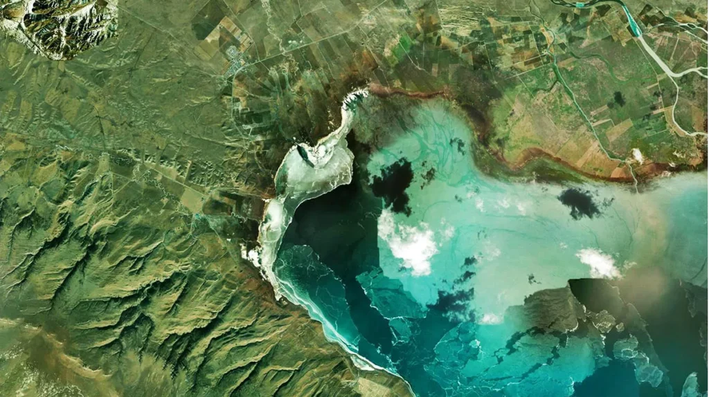 Satellite image of a coastal lagoon and surrounding landscape.