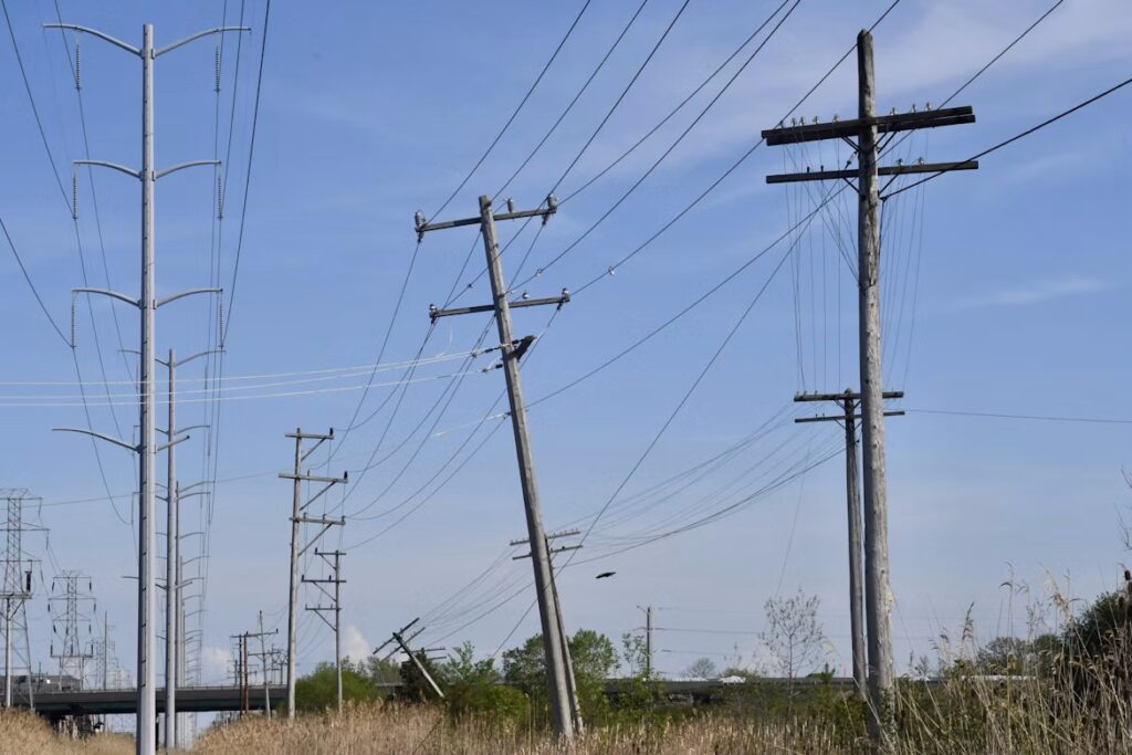 Leaning utility poles carrying overhead power lines.