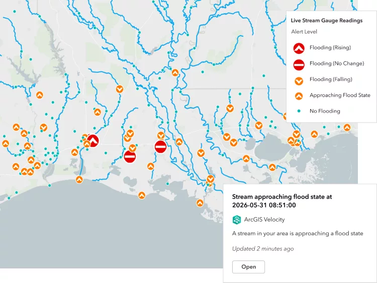 Map showing stream gauge readings with flood alerts, river networks and status markers across a region.